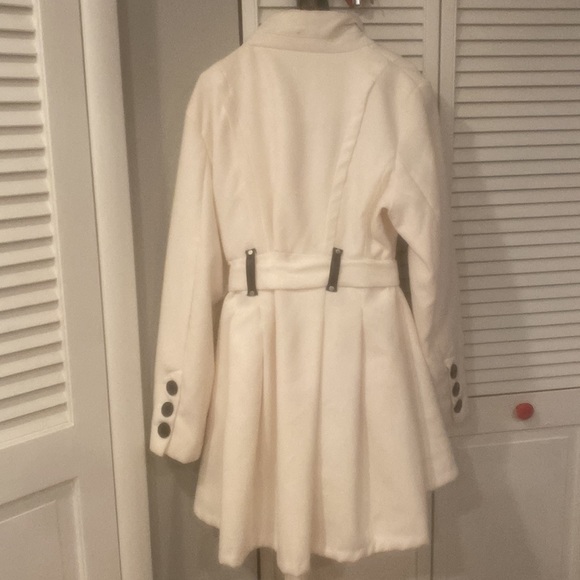 Woman’s white winter coat